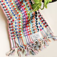 Luxurious multicoloured hand towel made from rows of pom poms with tassels/fringes - super absorbent and fast drying. Perfect for the bathroom or kitchen! These towels are extremely durable and eco-friendly, and will last you for years.