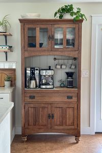 Turn an old hutch into your very own coffee bar cabinet. Say goodbye to cluttered countertops and hello to a custom coffee bar station.