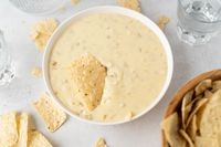 This isn't just any old cheese dip. This is the Best White Queso. This is the thing tortilla chips dream of at night, what tacos and burritos are just begging for, what a delicious carne asada needs to be perfect: a silky, velvety, melty dip of sharp cheese flavor and spicy chilies. It's rich, hot, and ready for whatever you have for dipping. It's the Best White Queso. You only need to taste it to agree.