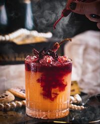 Margarita infused with hibiscus and topped off with a fabulous red wine