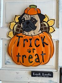 pug trick or treat wooden door hanger painted and sealed. 20 1/2"x 16 1/2"