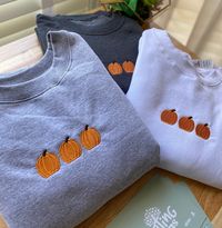 Pumpkin Embroidered Sweatshirt Crewneck is light weight, and perfect for layering! We use 4 UNISEX STYLE Brands: Smart Blank, Gildan, Cotton Heritage, & Hanes  The brand will depend on your size. All crewnecks are true to size.  However, if you enjoy a relaxed and lose fit, please size up.  ✈️ PRODUCTION TIME & SHIPPING:: Production Time: Sweatshirts are made within 3-5 business days from when the order is placed. Shipping Time: Standard Domestic Shipping  (3-5 business days after production tim