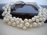 I designed this very romantic necklace with Ivory glass pearls,and ivory satin ribbon    It is boho chic design and also vintage inspired work      It