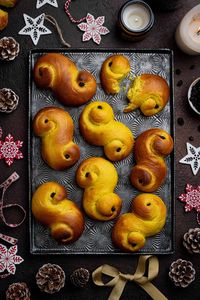 Vegan St. Lucia buns - these delicious Scandinavian saffron buns are traditionally baked in Sweden and Norway for St. Lucia's day (December 13th), and are known as Lussekatter because they look like curled up cats.

Flavoured with saffron and a touch of cardamom, these soft, fluffy, sweet buns are a delicious festive treat.