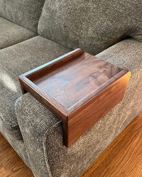 These high quality arm rest tables are handcrafted from your choice of gorgeous hardwoods; walnut, maple and cherry. Real hardwoods are durable with beautiful, and unique grain making each arm tray table truly one of a kind.  Tables are custom made to order according to your couches dimensions.  *When you place your order please select the option for the width of your arm rest.  Each piece is constructed by hand from high quality hard wood. We do not use any stain, the different color options are achieved through the natural color of the wood species.  *Please allow time for us to create your custom table.