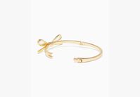 We say stack your bracelets to make a statement. This makes the first one in your pile. Or the 100th. | Kate Spade Skinny Mini Bow Bangle, Gold