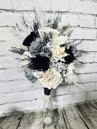 "Bridal Bouquet/Ivory/Black/Gray/minimalist/eucalyptus/ Sola Wood Flowers A variety of sizes available.  These sola flowers are handmade and there can be a slight difference in size and shape from flower to flower. Sola flowers are not fresh flowers. They are handmade wood flowers. The texture is similar to a really thin version of balsa wood. Because they are handmade, and made from natural materials, no two are exactly alike. Brown veining, sometimes small holes from a \"knot\" in the wood are