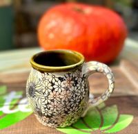 This wheel thrown mug has been through quite the process! I Watercolor the layered Underglaze Graphic transfer for a vintage, boho look. This mug showcases beautiful sunflowers, little daisies & honey bee!  Glazed in White, pink, yellow, Turquoise, Amber & Black * 12oz * In Stock It holds a generous 12 ounces and measures approximately 4.5"x3". This is the exact piece you will receive. Handmade from white stoneware clay, and fired to 2300 degrees using lead free, food safe glazes. All of my work