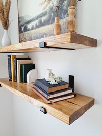 Our floating shelves would make a beautiful addition to any room in your home. Use them to display art, plants, pictures, books and so much more. Each shelf is handmade in our workshop, stained in the color of your choice and finished with two coats of polyurethane, ensuring that they will last for years and years to come. You will receive ONE solid wood shelf,  two heavy duty black J brackets, screws, drywall anchors and instructions to hang your shelf. If you have any questions, do not hesitat