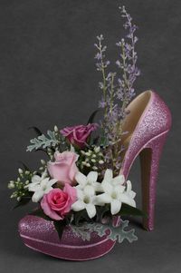 Stylish waterproof stiletto shoe containers for fresh and artificial flowers.