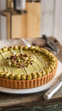 Indulge in this irresistible pistachio tart with creamy pistachio frangipane and a delightful pastry crust. A stunning vegan dessert that will impress everyone!