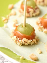 Caramel Apple Grapes are the perfect snack! Grapes dipped in caramel and then in nuts. A little treat that tastes like caramel apple in every bite.