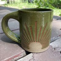 The Solstice Mug is handmade every step of the way. Hand-thrown, trimmed, glazed, fired, you name it. We love that no matter the day - rain or shine, from the summer solstice to winter solstice, and every day in between, you can bring your own sunshine.  This is a 12 ounce mug, however, since all of our pottery is handmade, items may differ slightly in size, shape, and or color/design for each piece. The keyword is handmade. It is made right at home on a beautiful Minnesota lake for you to enjoy