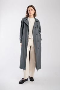 Classic mid-weight cotton trench jacket with seamed raglan sleeve detail. Jacket features adjustable button cuff, contrast binding finishing inside, welt pockets and a central back vent.