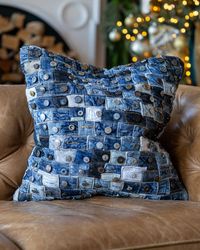 Includes: 1 Throw Pillow & Feather Fill⁣⁣Size: 20" x 20"⁣⁣⁣⁣Certifications: OEKO-TEX® | Fair Trade USA | BCI⁣⁣⁣⁣• 100% cotton• Hand-sewn with recycled denim• Sustainably sourced• Spot clean only• Made of recycled denim jeans and their unique buttons This pillow is just as unique as the home that you chose to put it in. The Indigo Throw Pillow is made of 100% recycled denim jeans and their button closures. We worked with our artisans to recycle vintage, thrifted and overstock jean pants and took