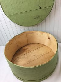 "This is a really cool item! A vintage cheese box that has been painted a light green. This would be great for a shop display, bakery, or home crafts. Measures 16\" diameter, 7\" tall. Made of very sturdy wood."