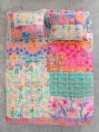 We love beautiful bedding! The Live Happy Reversible Quilt is made of the coziest, lightweight cotton, making it super soft. It also features a delicate, Kantha style hand-stitching for a vintage look and a fringe trim to finish! You'll love how easy it is to switch up your bedding with this reversible quilt that has mixed prints of flowers with a watercolor-painted look on one side, and bordered flowers on the other! Complete the set with the matching Live Happy Reversible Shams and Reversible