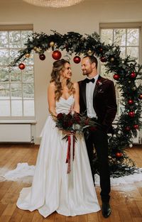 Burgundy Green Christmas Wedding Ideas Charly Mae Photography Crescent Moon Flower Arch Baubles Backdrop #wedding #backdrop