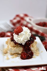 Raspberry Cheesecake Dessert  is out of this world! It has the most amazing crunchy crust, a luscious cheesecake layer, and is topped with gorgeous raspberry sauce! It's divine and makes enough for a crowd! #cheesecake #raspberrycheesecake #raspberrydessert #cheesecakedessert #creamcheese #dessert #dessertforacrowd #recipes #desserts #dessertfoodrecipes