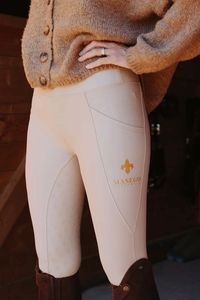 Our stunning Masego Riding Tights is all we ever dreamed of in a riding tight. -It's made out of a soft but firm material. The fabric is also dirt-repellent  -Full seat silicone grip. -Waist is high and steady and will not slide down while riding or working in the stable. -One mobile pocket on each side. -Shimmering go