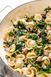 Orecchiette Pasta with Sausage and Broccoli Rabe uses chicken sausage in place of pork and a whole lot of garlic! This lightened up version will not disappoint!!