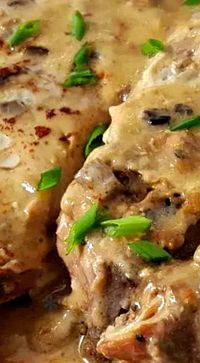 Crockpot Country Style Pork Ribs and Mushroom Gravy - super easy to prepare with tender pull apart pork ribs smothered with a savory mushroom gravy and sliced onions.