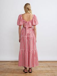 Gianna brings the drama and that's why we love her! Cut from bold red gingham seersucker, she's perfect to take you from spring soire's to summer rendezvous with ease. Just pair with your favourite boots now and sandals later.