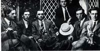 Members of the squad and others with Adj. Gen. Gearoid O'Sullivan (standing) L to R :- Joe Leonard, (Dublin Brigade member) Joe Slattery, Joe Dolan, William Stapleton. (Squad members): Charlie Dalton (Dublin Brigade member)