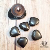 Cleanse and purge old, stagnant energy with the help of a Shungite Gemstone Heart from Inked Goddess Creations. Shungite is a very powerful healing stone and stone of protection. It contains strong purifying, cleansing, and detoxifying properties, making it a very powerful stone for healing. Thought to be around 2 billion years old, Shungite can unlock the wisdom of the ancients and ancestors before us. Shungite works to cleanse and align the chakras and your aura. Because of Shungite’s energy-c