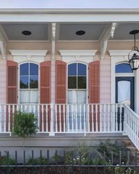 Pink house with coral shutters.