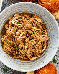 This Brown Sugar Pulled Chicken is the most tender and delicious chicken. Perfect for tacos, burritos, quesadillas or sandwiches. #slowcokerchicken #pulledchicken #recipe #instantpot