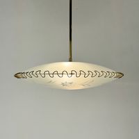 Beautiful flying saucer ceiling lamp from 40s Italy. It consists of two glass plates hold together by brass wire.  Takes regular edison E14 screw bulbs and it's suitable for all voltage systems.  Condition: Great vintage condition.  Dimensions: height: 70 cm / 28 inches diameter 46 cm / 18 inches - Combined shipping is very unpredictable, please ask for quote - I try to use as much recycled packaging as possible, for reasons well known. Let me know if it's a gift. I'll give it a comfy home for t