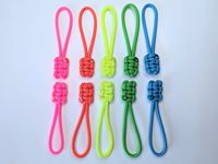 Our paracord zipper pulls are soft, simple, and lightweight. Add to zippers to have a larger pull tab. Adds personality / a pop of colour to zippers. Accessorize your zippers! SET OF 5 OR 10 NEON PARACORD ZIPPER PULLS COBRA WEAVE -Neon Pink, Neon Orange, Neon Yellow, Neon Green, Neon Turquoise *All zipper pulls are made with leftover paracord ends from the leashes in order to reduce our waste! *Zipper pulls are approximately 4 inches long.  *Zipper pulls come in a set of  5 or 10.  Set of 5 has