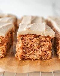 old-fashioned apple cake cut in squares on cooling rack