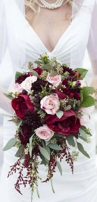 I love the deep red roses with the soft pink ones. A stunning wedding bouquet.