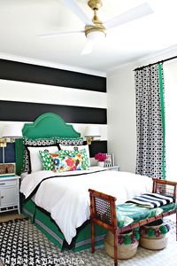 ONE ROOM CHALLENGE- TEEN GIRL'S BEDROOM REVEAL || Black, White, Kelly Green Bedroom || Dimples and Tangles || green upholstered headboard, black and white striped wall, black and white curtains, wall sconces, black crosses rug, pom pom baskets, bamboo bench