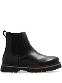 black leather panelled design debossed logo to the side elasticated side panels slip-on style pull-tab at the heel ankle-length ridged rubber sole round toe