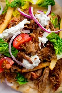 My favourite recipe for Crispy Pork Gyros - including how to get that perfect crispy-on-the-outside and tender-on-the-inside meat! #StreetFood #Recipe #Homemade