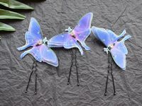 Silk purple or green luna moth butterfly hair pins with three-layer wings and crystals. 3D butterflies are carved me by hand and decorated with rhinestones. No glue, only handmade. Luna moth wings are impregnated with a special solution, which allows them to remain elastic and tender at the same time. Swaying easily from the wind. Create a romantic look. You can decorate your hair with them and complement the look for a wedding or birthday.  PRODUCT SPECIFICATIONS: Size of luna moth is about 7 c