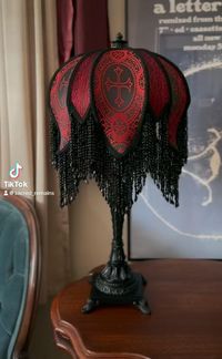 Welp, I’m kind of in love with this lampshade and I’m seriously considering keeping it 😃 But it will most likely be on my table at the @midnightmoonmkt on 5/25. Any thoughts on what I should title this one?? I’m currently workshopping “Red Sexy Beast” but I�’m not sure that one will stick 😂 #victorianlampshade #victorianlampshades #lampshades #handmade #handstitched #salem #salemmassachusetts #salemmass #salemma #darkaesthetic #gothaesthetic #gothdecor #gothhomedecor #gothlighting#darkhomedec...