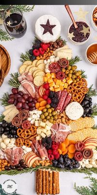 This ultimate show-stopping Christmas Tree Charcuterie Board recipe idea creates a stunning and tasty holiday party centerpiece. Nothing brings instant holiday cheer like this Christmas charcuterie board shaped like a Christmas tree loaded with best grazing snack foods.