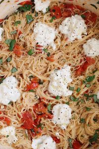 Dainty angel hair pasta + bursts of flavor from cherry tomatoes, garlic and basil.