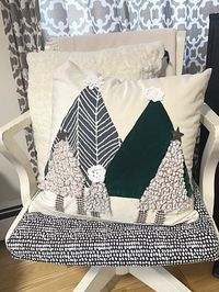 Here is a fun and easy way to create a Christmas pillow using a plain pillow cover and scrap fabric. You probably have most of the materials for this project at home already... First, I started with a plain cream colored velvet pillow form from Amazon. (affiliate link) You could also recycle an old pillow cover if the design on it is small or neutral.I gathered the fabrics I wanted to use for this project, they were all colors and textures I wanted for trees.I used a green velvet…