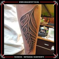 Black and grey feather, tribe inspired.  Designed and tattooed by: Jamy Bonte Dragon Tattoo.