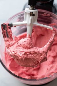 Intensely flavorful raspberry buttercream frosting! #bakedbyanintrovertrecipes #frosting #buttercream #raspberry #raspberries