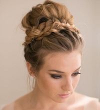 messy prom hairstyle with braid around