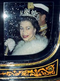 1965: The Queen in Her Carriage The Queen on her way to the State Opening of Parliament in 1965.