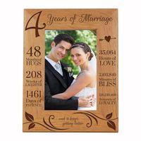 Engraved Anniversary Picture Frame Dimensions: 8" x 10" Frame holds a 4" x 6" photo Celebrate your special anniversary day with your lover by enjoying LifeSong Milestones Solid Wood Wedding Anniversary Picture Frame. Get this gift as a keepsake to remember your special day you made the ultimate bond. LifeSong Milestones has created the perfect Fourth Anniversary photo frame gift. Wooden picture frames were designed, handcrafted, and engraved by © 2019 LifeSong Milestones.