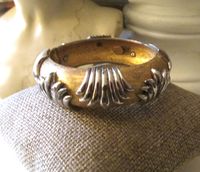 Lovely vintage gold and silver tone hinged bangle by Pauline Rader! In good vintage condition, showing minor surface wear. Approx. 2.5" diameter interior   Will fit a small or medium wrist!