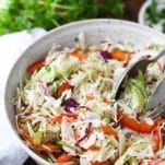 A sweet and tangy old-fashioned Vinegar Coleslaw is the perfect easy side dish to serve with pulled pork, barbecue ribs, grilled chicken and grilled hamburgers. The vinegar based coleslaw adds an acidic element that perfectly balances rich, meat-based entrees. Serve it at your next cookout, potluck, or Sunday supper, because this popular Southern vinegar slaw is always a crowd favorite!